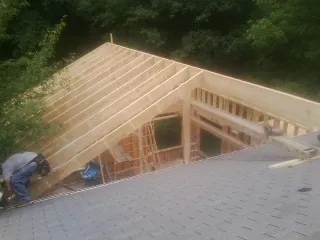 Framing a new roof addition that ties into an existing shingle roof in Tallassee